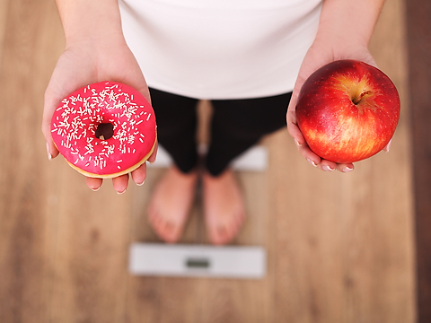 weighing up the consequences of a doughnut and an apple
